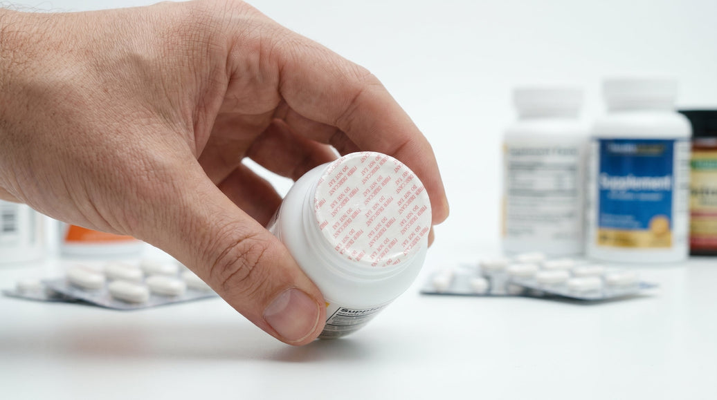 Fiber desiccant seal fitted to a supplement bottle, the same closure format used for veterinary powders and premixes