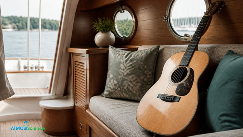 Acoustic guitar inside a sailboat cabin at a marina, instrument humidity control for boat musicians