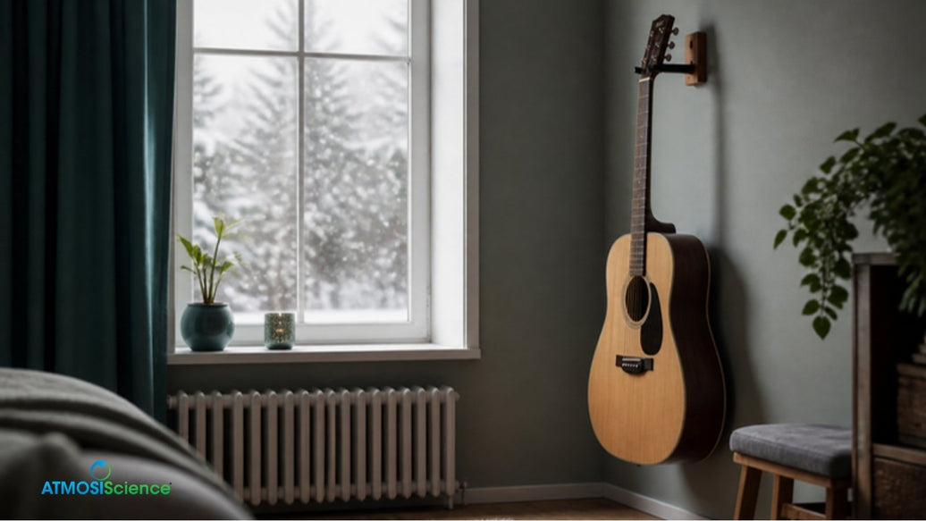 Acoustic guitar in a winter music room with snow outside and a radiator, guitar humidity in heating season