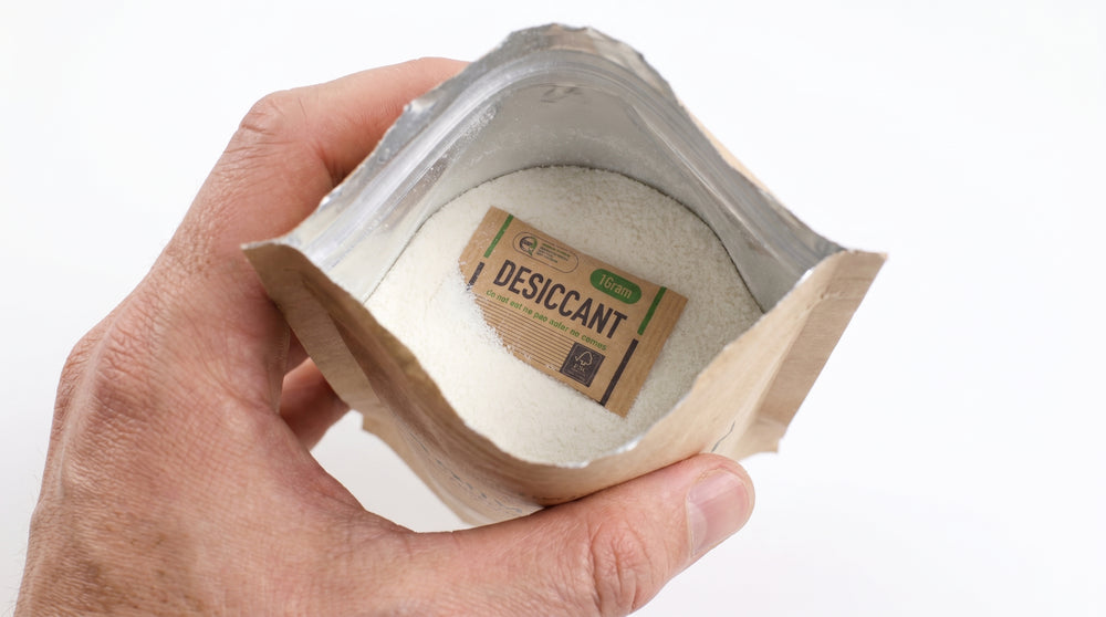 Branded fiber desiccant disc placed inside a flour pouch