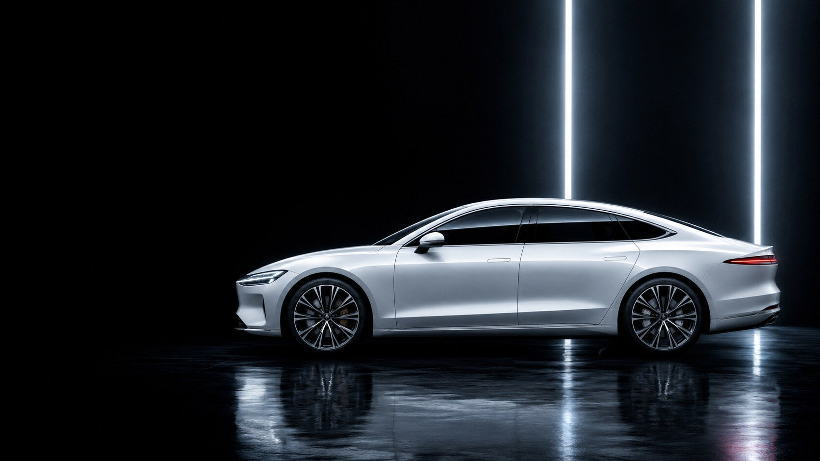 Electric vehicle side profile lit in a dark studio